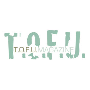 Image contains a white background with large green letters in the middle. The letters say "T.O.F.U." and there are smaller letters in the middle of this word that say "T.O.F.U. Magazine".